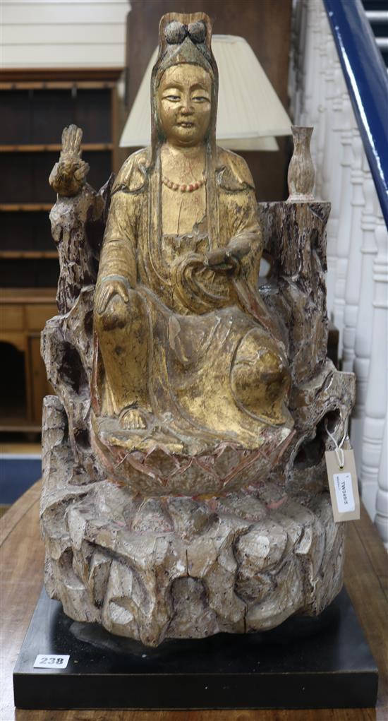 A Chinese carved and gilded wood figure of Guanyin, late 17th century, H approximately 58cm (figure)